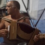 Patrick your skipper playing accordion